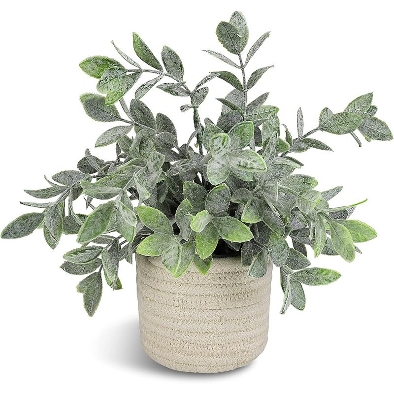 Faux plant in woven pot