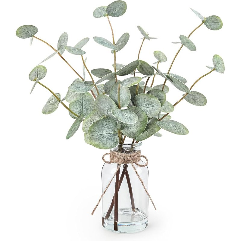 Faux eucalyptus in a glass vase